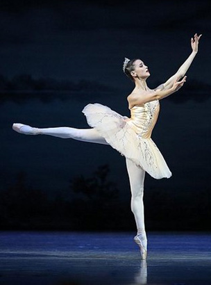 A ballet performance is visually characterized by its minimal, understated elegance.